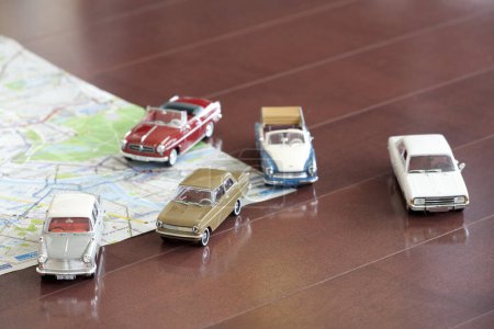 Photo for Bunch of toy cars on map - Royalty Free Image