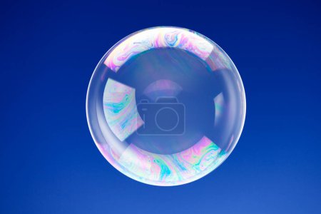 Photo for Colorful soap bubble on blue background - Royalty Free Image
