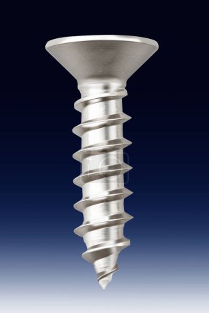 Photo for Metal screw on blue  background - Royalty Free Image