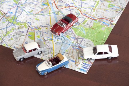 Photo for Bunch of toy cars on map - Royalty Free Image