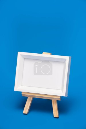 Photo for Blank canvas frame with copy space. Easel - Royalty Free Image