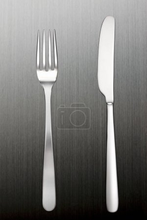Photo for Metal cutlery set on a gray concrete background - Royalty Free Image