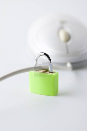 White computer mouse with padlock, online security concept