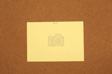 Photo for Yellow paper note on the cork board - Royalty Free Image