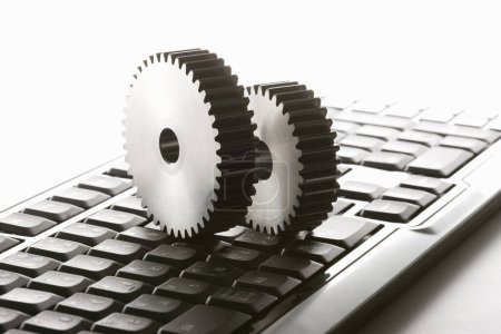 Photo for Computer keyboard and gears on white background. Computer settings concept - Royalty Free Image