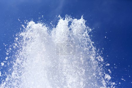 Photo for Water splashes against blue sky - Royalty Free Image