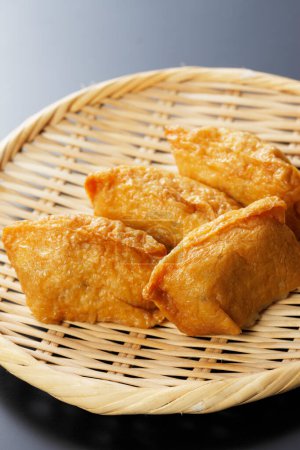 Photo for Close up view of seasoned rice wrapped In fried tofu bags - Royalty Free Image