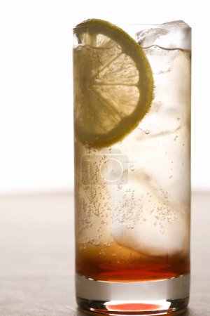 Photo for Glass of fresh cold cocktail with lemon slice - Royalty Free Image