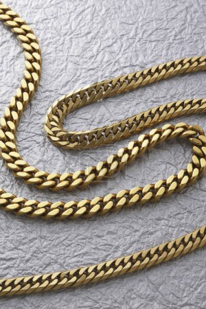 Photo for Beautiful golden chain on  background, close up - Royalty Free Image