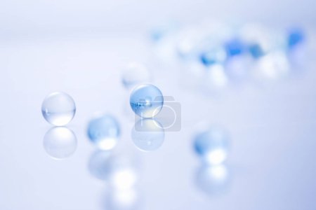 Photo for Blue transparent glass balls with reflection on the surface - Royalty Free Image