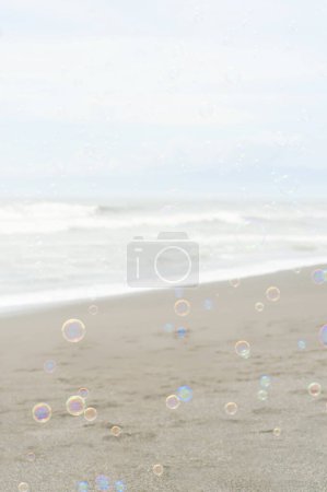 Photo for Soap bubbles on the beach - Royalty Free Image