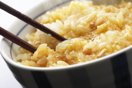 Photo for Delicious japanese rice with egg in bowl, close up view - Royalty Free Image