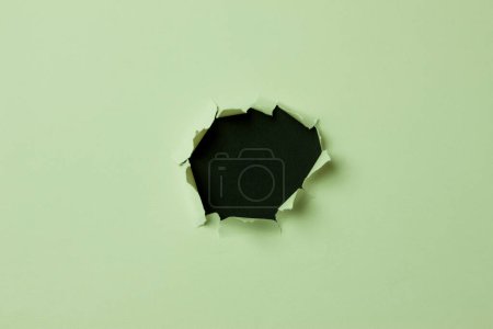 Photo for White torn hole on paper background - Royalty Free Image