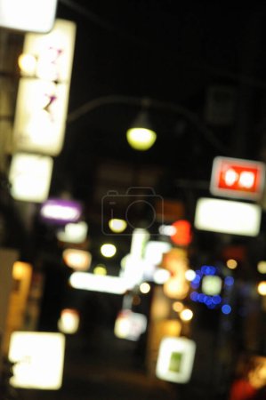 Photo for Blurred night view of Japanese city street - Royalty Free Image