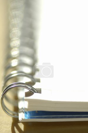 Photo for Metal spiral of notebook on a white background - Royalty Free Image