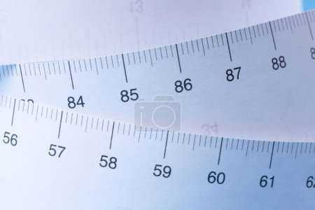 Photo for Close-up view of tape measure on blue background - Royalty Free Image
