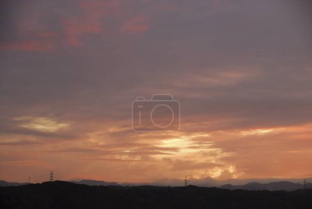 Photo for Amazing landscape with beautiful sunset sky over dark hills - Royalty Free Image