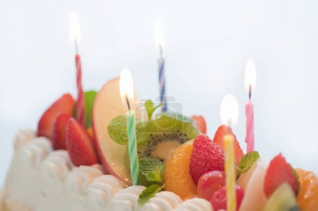 Photo for Close-up view of delicious birthday cake with cream and fruits - Royalty Free Image