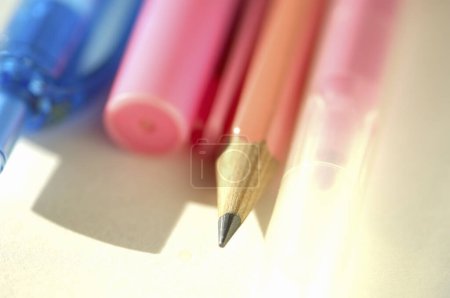 Photo for Colored pencils for drawing and pen on table - Royalty Free Image