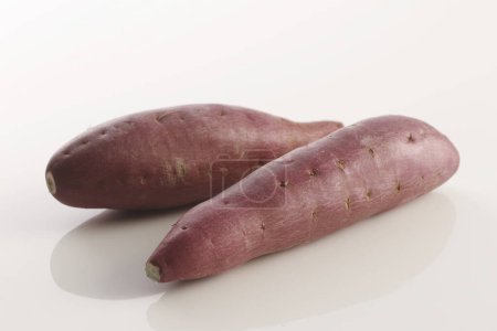 Photo for Purple sweet potatoes isolated on white background - Royalty Free Image