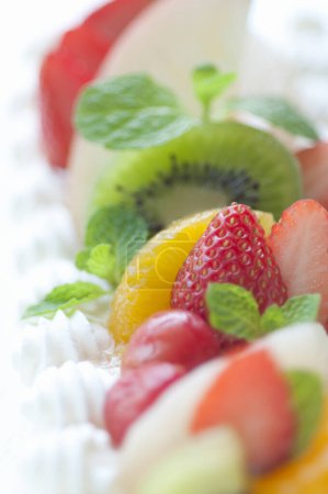 Photo for Close-up view of delicious birthday cake with cream and fruits - Royalty Free Image