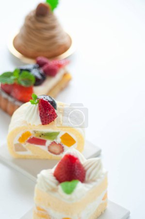 various delicious cakes with fresh berries. Sweet desserts