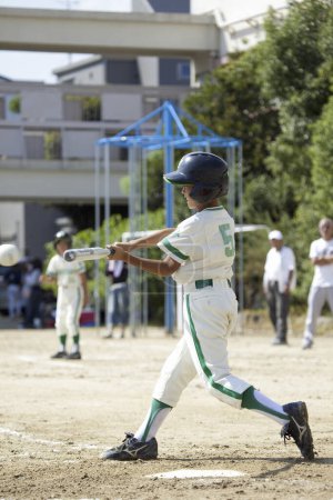 Photo for Japanese boy playing baseball game, little league - Royalty Free Image