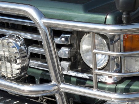 Photo for A green truck with a chrome grille and a light - Royalty Free Image