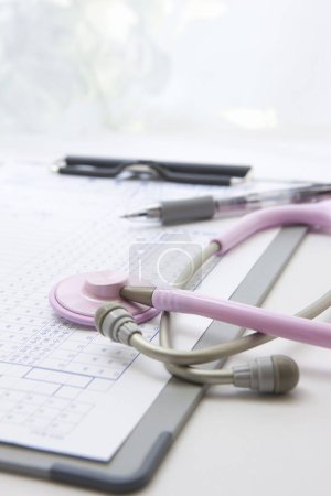 Photo for Medical Record And Pink Stethoscope - Royalty Free Image