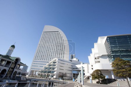 Photo for Tall, shiny buildings in Tokyo under a bright blue sky. - Royalty Free Image