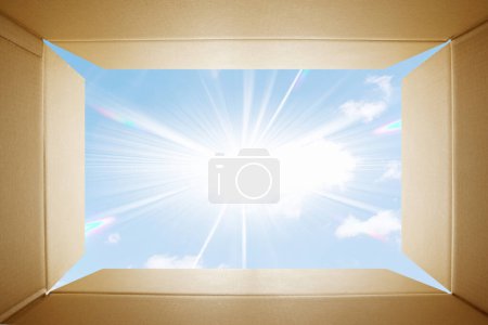 Photo for Open cardboard box with sun outside - Royalty Free Image