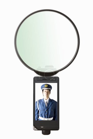 Photo for Phone screen with portrait of japanese polcie offier - Royalty Free Image
