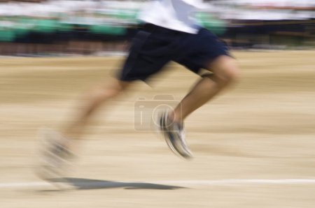 Photo for Motion blurred view of athlete running during sport competition - Royalty Free Image