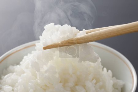 Photo for White rice in bowl and chopsticks - Royalty Free Image