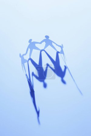Photo for Closeup of paper people family cut on background - Royalty Free Image