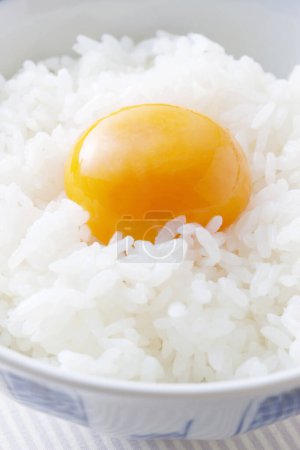 Photo for A bowl of rice with an egg on top - Royalty Free Image
