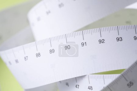 Photo for Close-up view of tape measure on yellow background - Royalty Free Image