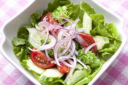 Photo for Green salad with tomatoes and red onions - Royalty Free Image