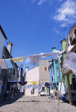 Photo for Drying laundry on street of Burano island, Italy - Royalty Free Image