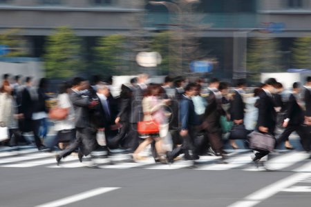 Photo for Crowd walking by central street in Tokyo city, Japan - Royalty Free Image