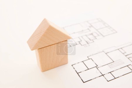 Photo for Close-up shot of house made of wooden blocks on light background - Royalty Free Image