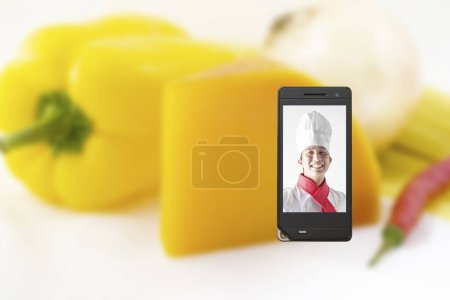 Foto de Retrato de joven japonés hombre chef en la pantalla del teléfono móvil, comida concepto fondo - Imagen libre de derechos