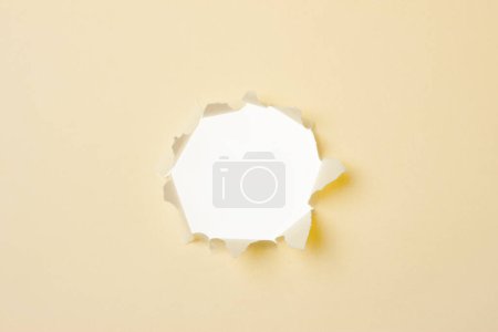 Photo for White torn hole on paper background - Royalty Free Image