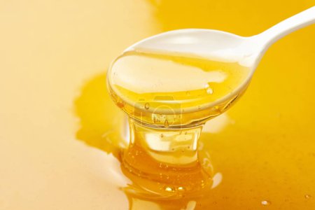 Téléchargez les photos : Vue rapprochée du miel bio doux frais - en image libre de droit