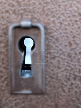 Photo for A vertical shot of a door lock on background, close up - Royalty Free Image