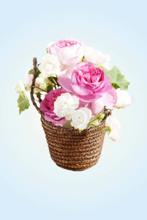 Photo for Wicker basket with roses - Royalty Free Image