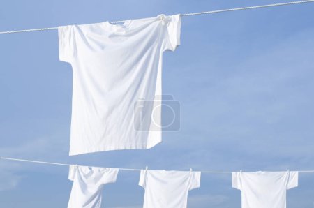 Photo for White laundry hanging on clothesline - Royalty Free Image