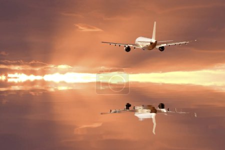 Photo for Airplane flying above clouds in sunset. - Royalty Free Image
