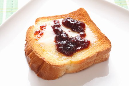 Photo for Toast with jam for breakfast, closeup on background - Royalty Free Image