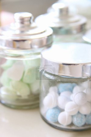 Photo for Colorful sweet candies in glass jars, close up view - Royalty Free Image